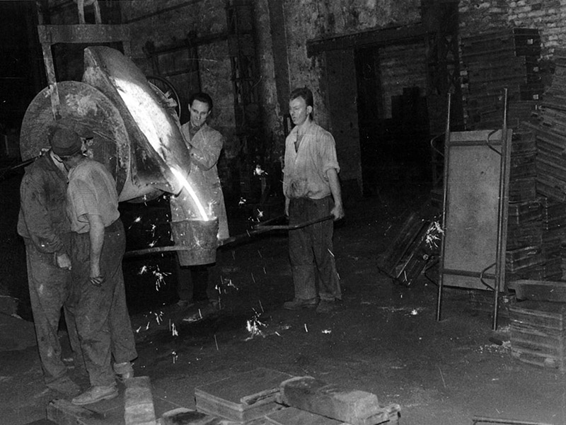 Worker casting metal at the LMF foundry